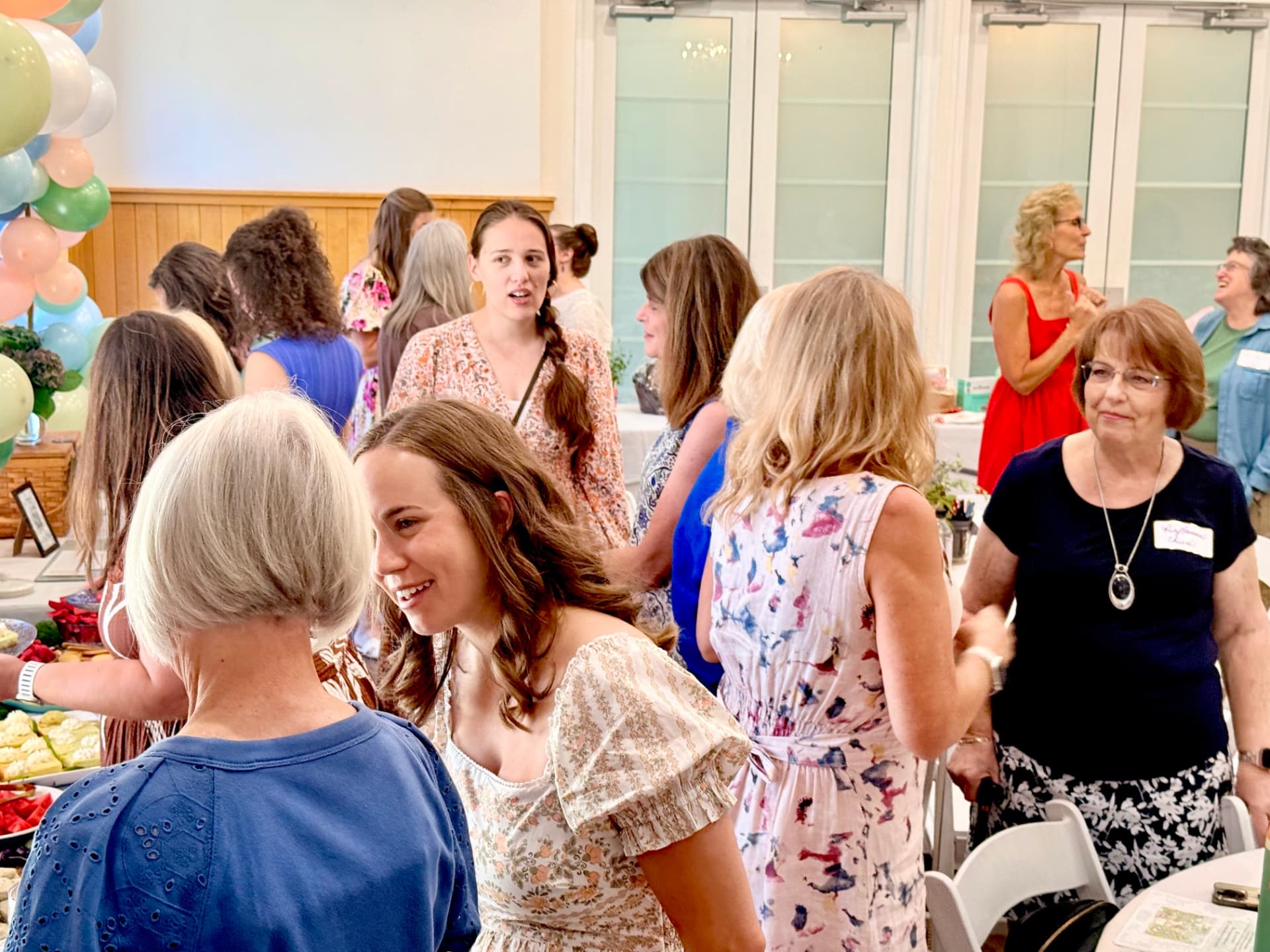 Women gathered and talking together at a Cornerstone women's event